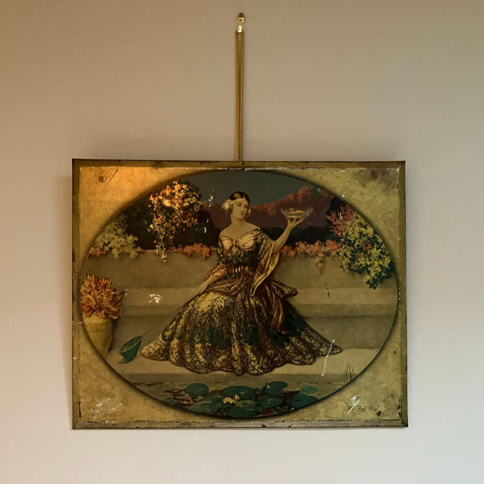 Vintage print on metal of crinolined lady